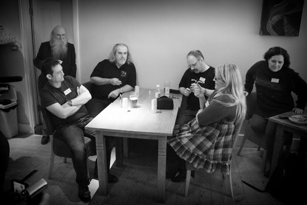 A group of vapers sitting around a table.