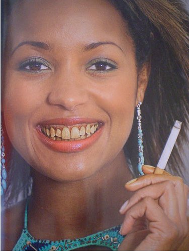 This quit-smoking ad shows teeth stained by cigarette smoke. 