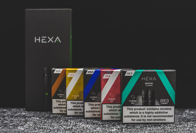 The Hexa Vape kit pictured next to Hexa cartridges. 
