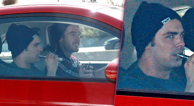 Zac Effron vaping in a car