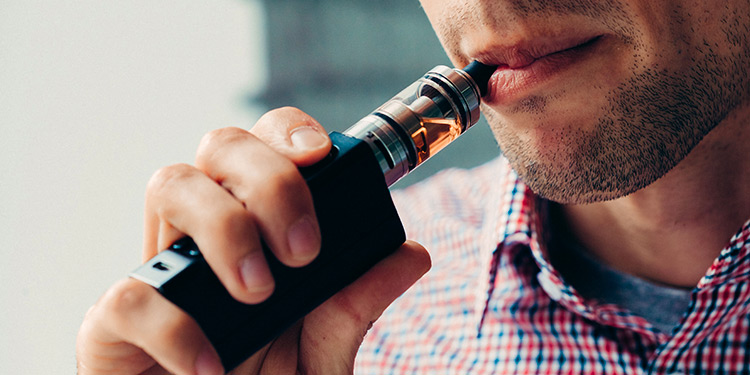 Featured image: Man with vape device.