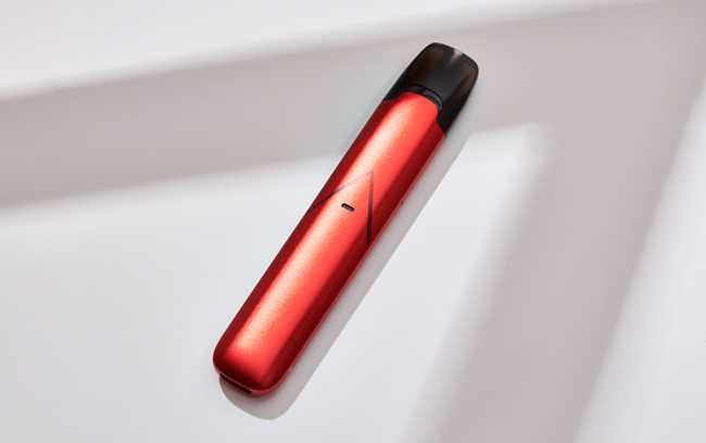 Light red pod device on a white background. 