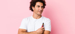 Man holding a vape kit